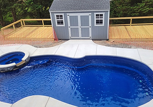 happy family enjoying their fiberglass swimming pool experience