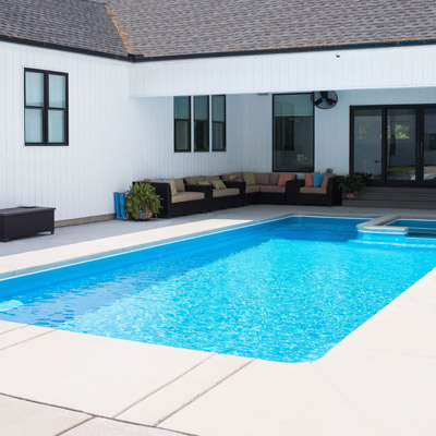 brushed concrete decking options for your fiberglass pool